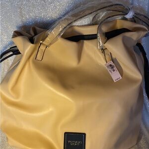 New Victoria’s Secret tan purse $30 tags on it $58
